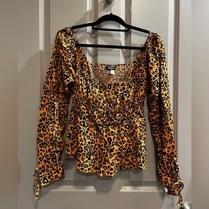 Urban Outfitters long sleeve cheetah-print blouse (size Large)
